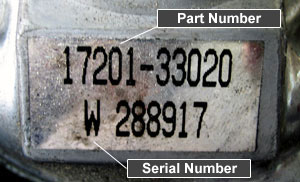 Sticker on the compressor housing showing the full Toyota Part Number and the Serial Number
